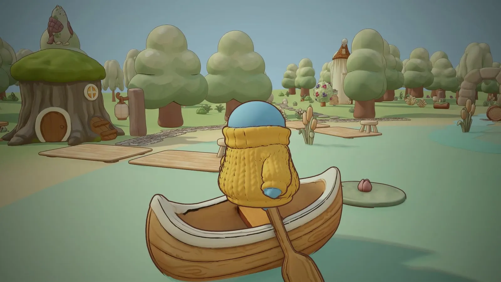 The blob paddles a wooden canoe across the pond